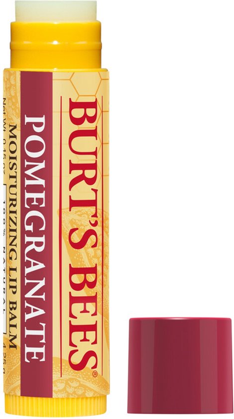 Burt's Bees lippenbalsem met granaatappelgeur. Geel met rood-bruine opdruk. Dopje ernaast.