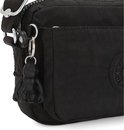 Detail van een zwarte Kipling tas met een aapje als sleutelhanger aan de rits.
