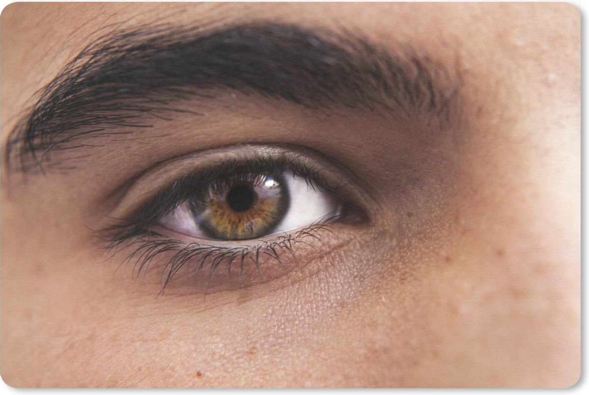 Muismat Closeup Ogen Closeup van het bruine oog van een jong persoon met sproeten...