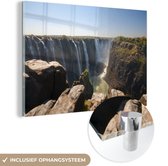 MuchoWow® Glasschilderij 180x120 cm - Schilderij acrylglas - De Victoria Falls vanaf de klif - Foto op glas - Schilderijen