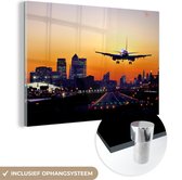 MuchoWow® Glasschilderij 120x80 cm - Schilderij acrylglas - Vliegtuig land in London - Foto op glas - Schilderijen