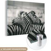 MuchoWow® Glasschilderij 120x80 cm - Schilderij acrylglas - Knuffelende zebra's - Foto op glas - Schilderijen