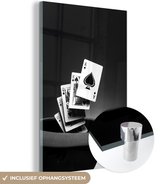 MuchoWow® Glasschilderij 100x150 cm - Schilderij acrylglas - Royal straight flush uit de hoed - zwart wit - Foto op glas - Schilderijen