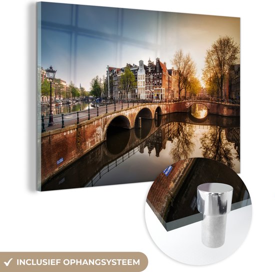 MuchoWow® Glasschilderij 120x80 cm - Schilderij acrylglas - Zon - Amsterdam - Water - Foto op glas - Schilderijen