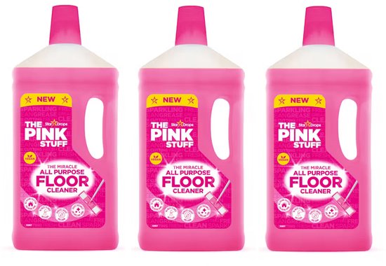 Drie flessen 'The Pink Stuff' allesreiniger op een witte achtergrond.