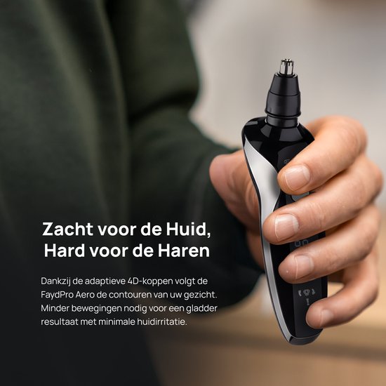 Zwarte Fayd Pro neustrimmer, vastgehouden in een hand. Zacht voor de huid, hard voor de haren.