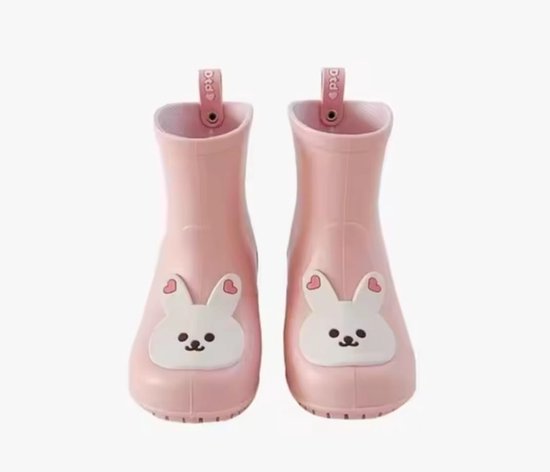 Bottes de pluie roses avec applications de lapin blanc, y compris des cœurs sur les oreilles.