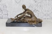 Statue en bronze danseuse assise