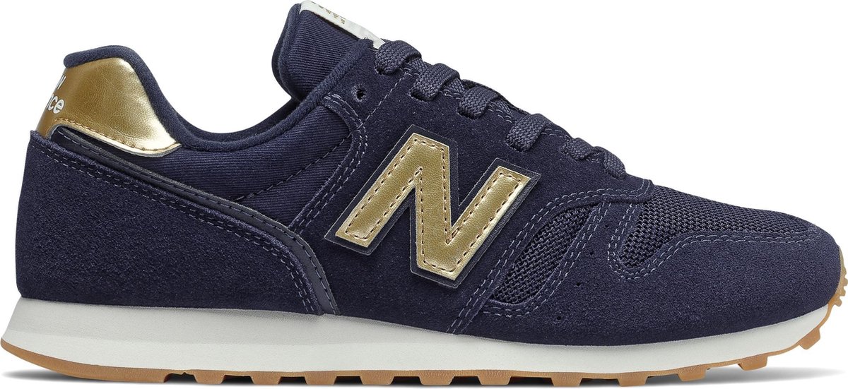 New Balance 373 suede sneakers donkerblauw goud - Schoenen.nl
