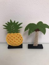 Decoratieve beeldjes, ananas en palmboom
