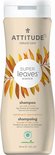 Crèmekleurige fles met bladerenprint. "Super Leaves science", "volume & shine shampoo".