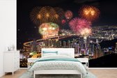 Behang - Fotobehang Vuurwerk boven de Zuid-Koreaanse stad Busan - Breedte 390 cm x hoogte 260 cm