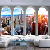 Fotobehangkoning - Behang - Vliesbehang - Fotobehang Uitzicht op New York vanaf de Pilaren - Pillars and New York - 150 x 105 cm