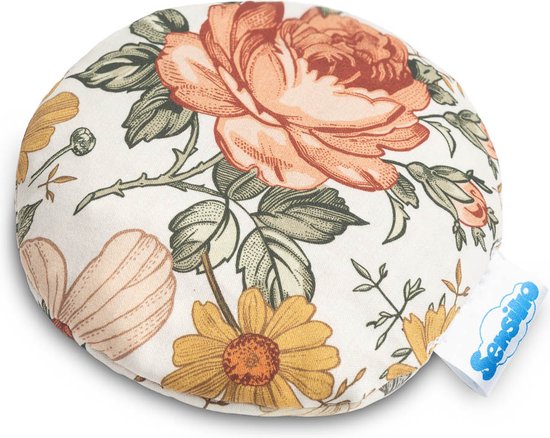Ronde pittenzak met een vintage bloemenprint in roze, oranje, geel en groen op een witte achtergrond. Een blauw label is zichtbaar.
