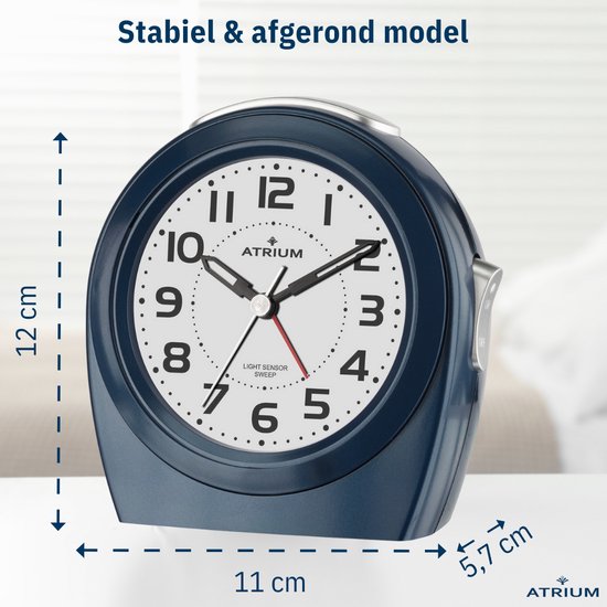 Stabiele, afgeronde donkerblauwe wekker. Diameter 11 cm, hoogte 12 cm, diepte 5,7 cm.