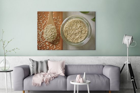 Canvas schilderij 120x80 cm - Wanddecoratie Quinoa in een glazen kom en op een houten lepel - Muurdecoratie woonkamer - Slaapkamer decoratie - Kamer accessoires - Schilderijen op canvas