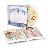 Melanie Martinez Cry Baby CD met hoesje en fotoboekje met illustraties van een meisje en speelgoed.
