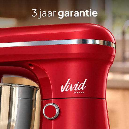Close-up van een rode Vivid Green keukenmachine met 3 jaar garantie tekst erboven.