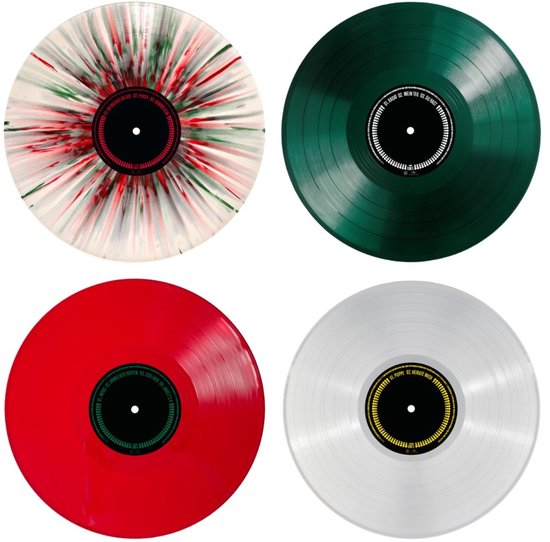 Vier vinylplaten: een met rood-groene spetters, een effen groene, een rode en een transparante plaat.