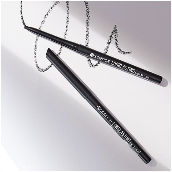 Twee zwarte essence LONG-LASTING eye pencils, één met dop, met zwarte vegen op papier.