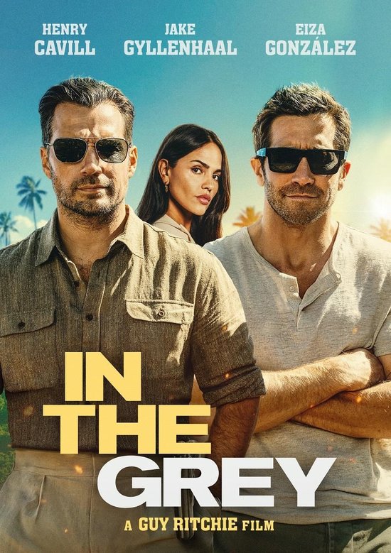 Poster van "In The Grey" met Henry Cavill, Jake Gyllenhaal en Eiza Gonzalez. De titel is in gele letters.