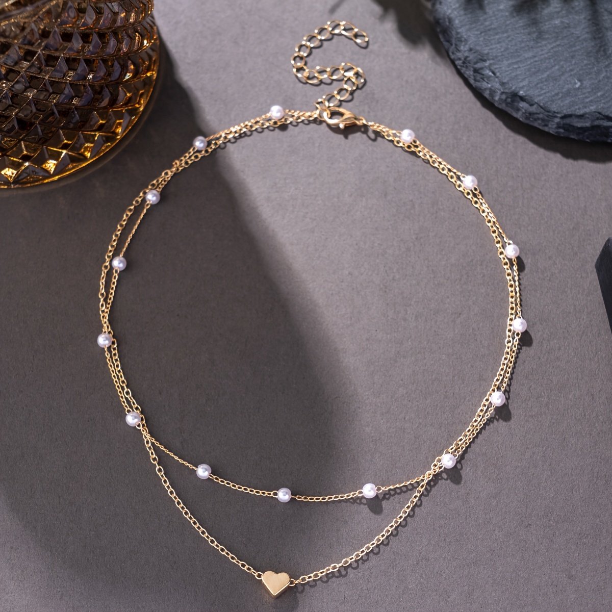 Sjika - Dubbele Ketting Dames Goud – Layered Ketting met Parels en Hartje – Goudkleurige Damesketting – Romantisch Sieraad – Cadeau voor Haar