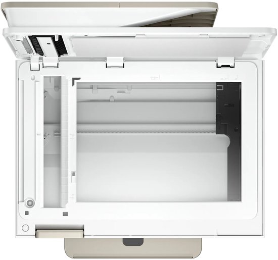 Bovenaanzicht van de geopende scannerplaat van een witte HP Envy Photo printer met beige afwerking.