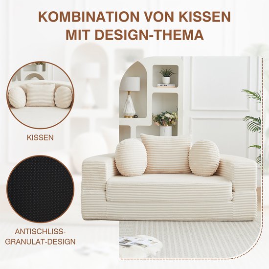 Beige ribfluwelen bank met ronde en vierkante kussens en anti-slip bodem.