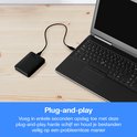 Zwarte WD Elements externe harde schijf aangesloten op een laptop.