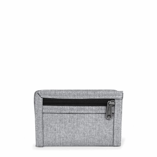 Grijze Eastpak Mini Crew portemonnee van textiel met een ritssluiting aan de voorkant.