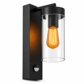 Zwarte buitenwandlamp met helder glazen cilinder en sensor. Moderne vormgeving.