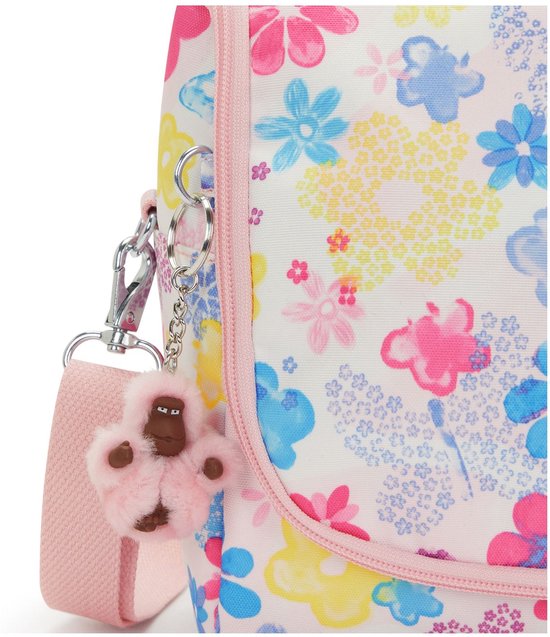 Detail van de witte lunchtas met bloemenprint en een roze aapjes-sleutelhanger.