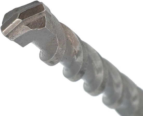 Detail van de koperkleurige carbide kop van een hamerboor.