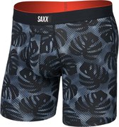 Zwarte boxershort met bladerprint en gestreepte details, oranje band met SAXX logo.