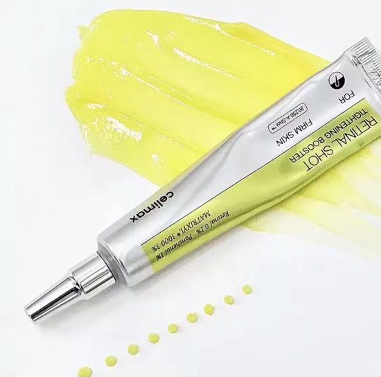 Celimax Retinal Shot Tightening Booster tube met gele crème en stipjes.