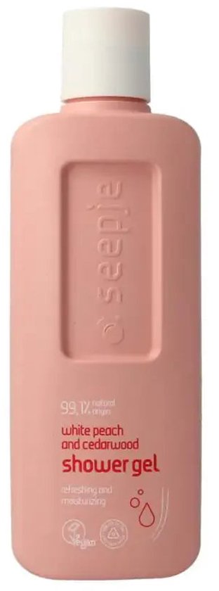Roze fles Seepje witte perzik en cederhout douchegel met witte dop. Tekst: 99.1% natural origin, white peach and cedarwood shower gel.