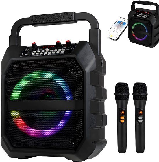 Enceinte karaoké noire avec anneau lumineux, avec deux microphones et un smartphone à côté.