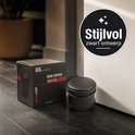 Zwarte deurstopper naast de verpakking, met het label 'Stijlvol zwart ontwerp'.