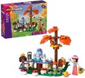 LEGO Friends bosfeest speelset met tafel, boom en 4 figuren, naast de verpakking.