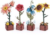 Set van 4 houten 3D-bloemen: roos, blauwe bloem, zonnebloem en margriet in houten potjes.