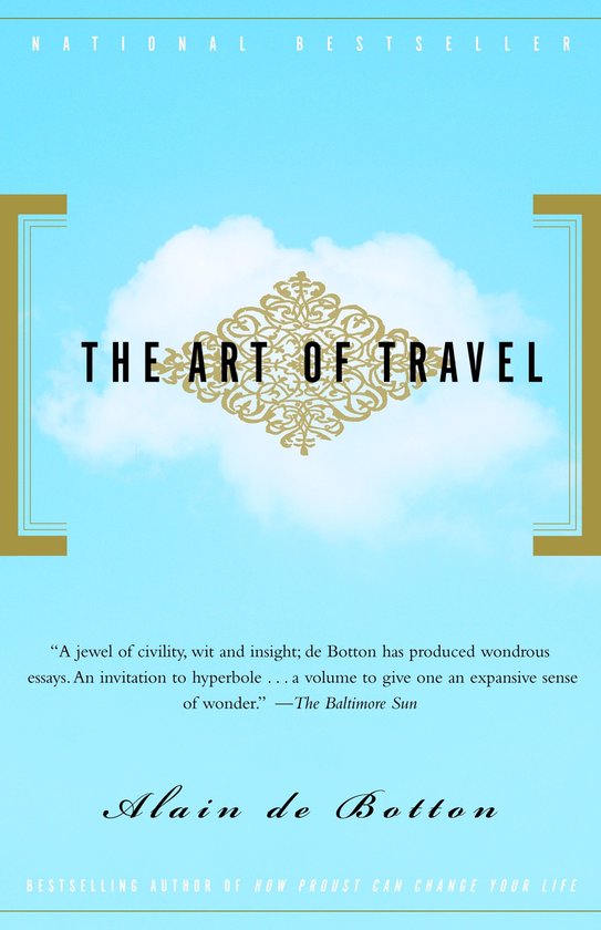 Livre 'The Art of Travel' avec des ornements dorés sur fond bleu ciel, 'NATIONAL BESTSELLER' et 'Alain de Botton' sur la couverture.