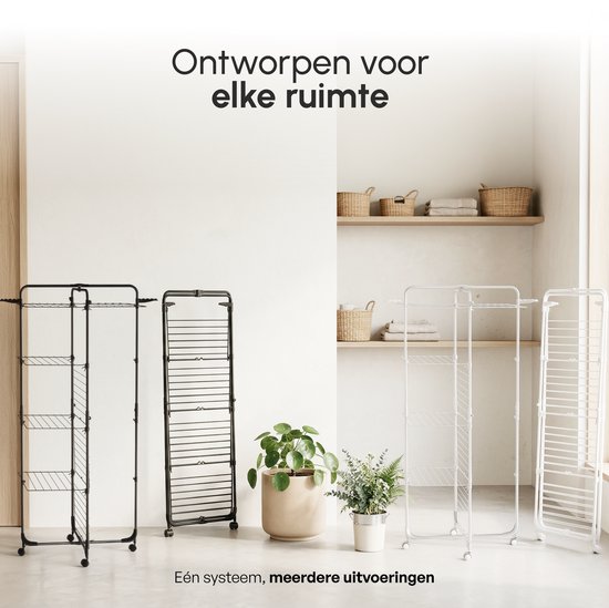 Verschillende droogtorens, waaronder een zwarte en een witte, in een lichte kamer.