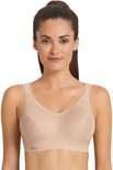 Vrouw in een beige sportbeha met "Anita ACTIVE" logo.