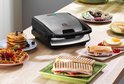 Tefal snackapparaat met verschillende bereidingen zoals wafels en tosti's.