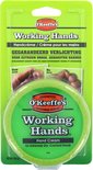 O'Keeffe's Working Hands Handcrème verpakt in plastic met voor-en-na foto's van handen. De pot is groen.