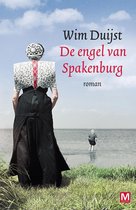 Boekomslag van 'De engel van Spakenburg' met een vrouw in traditionele klederdracht staand op het strand.