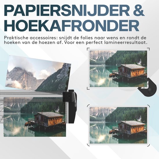 Papiersnijder en hoeksnijder met een geplastificeerde afbeelding van een huisje aan een meer.