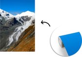 Behang - Fotobehang De weg in Oostenrijkse Alpen bij de Großglockner Hochalpenstraße - Breedte 175 cm x hoogte 260 cm
