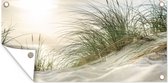 Tuinposter Duinen met helmgras onder de zon van het Duitse nationaal Park Schleswig-Holsteinisches Wattenmeer - 60x30 cm - Tuindoek - Buitenposter