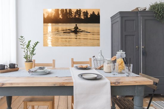 Un homme rame à un coucher de soleil Poster 120x80 cm - Tirage photo sur Poster (décoration murale salon / chambre) / Affiche de Sport
